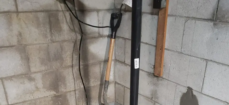 Sump pump system with interior drainage feeding the pit, installed by the AVH Foundations family